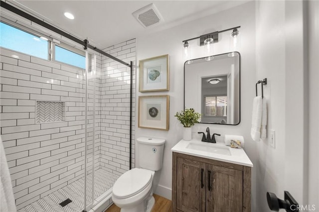 2812 Loyola St, Riverside, CA 92503 - full bathroom featuring a shower stall, toilet, vanity, and wood finished floors