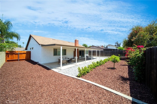 2812 Loyola St, Riverside, CA 92503 - rear view of property featuring a chimney, a fenced backyard, a patio, and stucco siding