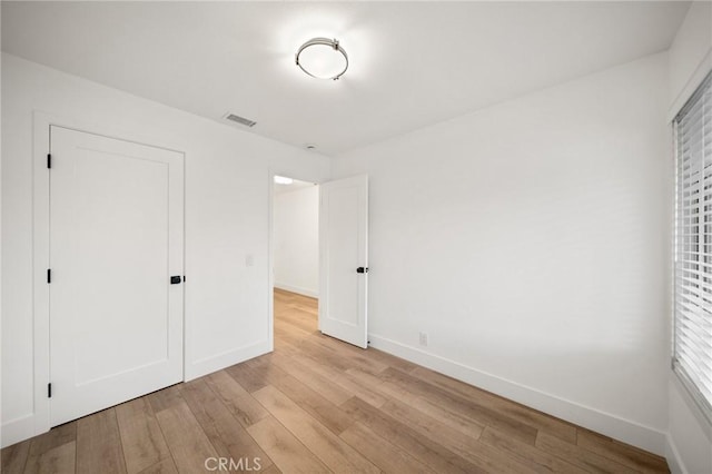 2812 Loyola St, Riverside, CA 92503 - unfurnished bedroom featuring wood finished floors and baseboards