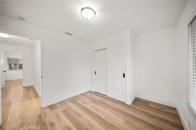 2812 Loyola St, Riverside, CA 92503 - unfurnished bedroom with light wood-style flooring, baseboards, and a closet