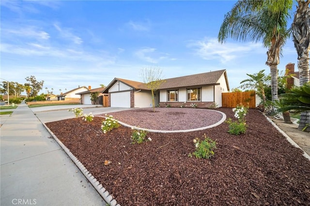 2812 Loyola St, Riverside, CA 92503 - ranch-style house featuring concrete driveway, a garage, fence, and stucco siding