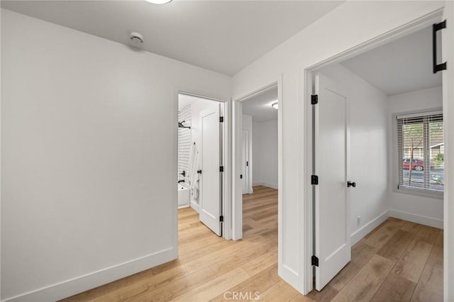 2812 Loyola St, Riverside, CA 92503 - corridor featuring light wood-style flooring and baseboards