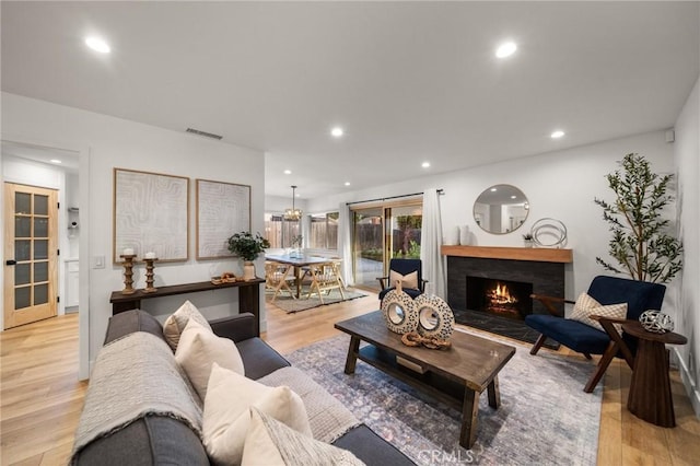 2812 Loyola St, Riverside, CA 92503 - living room featuring light wood-style flooring, recessed lighting, and a fireplace