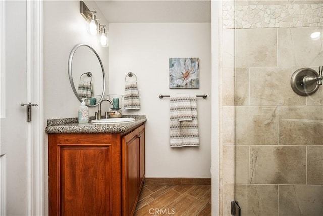 17252 Breda Ln, Huntington Beach, CA 92649 - full bath with vanity, tiled shower, baseboards, and wood finished floors