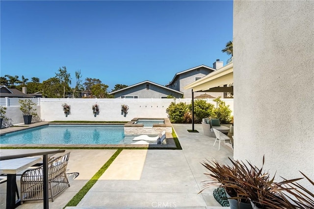17252 Breda Ln, Huntington Beach, CA 92649 - view of swimming pool with a patio area, a fenced backyard, and a pool with connected hot tub