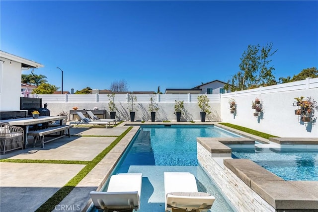 17252 Breda Ln, Huntington Beach, CA 92649 - view of swimming pool featuring a fenced backyard, a patio area, and a pool with connected hot tub