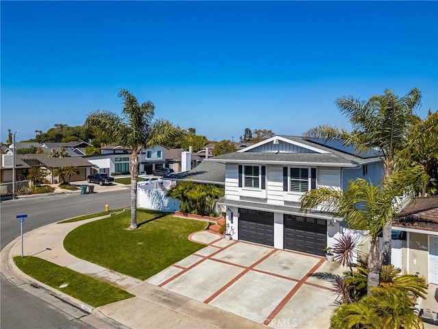 17252 Breda Ln, Huntington Beach, CA 92649 - view of front facade with concrete driveway, a garage, a residential view, a front yard, and a shingled roof