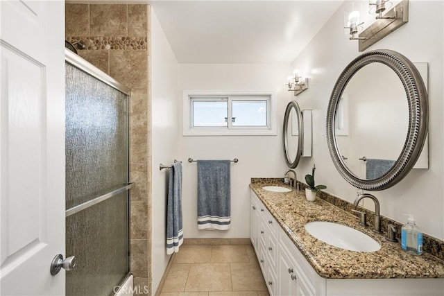 17252 Breda Ln, Huntington Beach, CA 92649 - full bathroom with a stall shower, baseboards, tile patterned floors, and double vanity