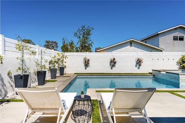 17252 Breda Ln, Huntington Beach, CA 92649 - view of swimming pool featuring a fenced backyard, a patio, and a pool with connected hot tub