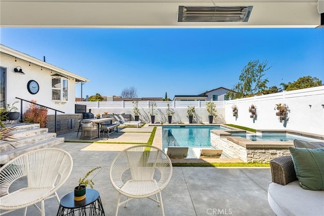 17252 Breda Ln, Huntington Beach, CA 92649 - view of pool featuring outdoor dining space, a fenced backyard, a patio, and a pool with connected hot tub