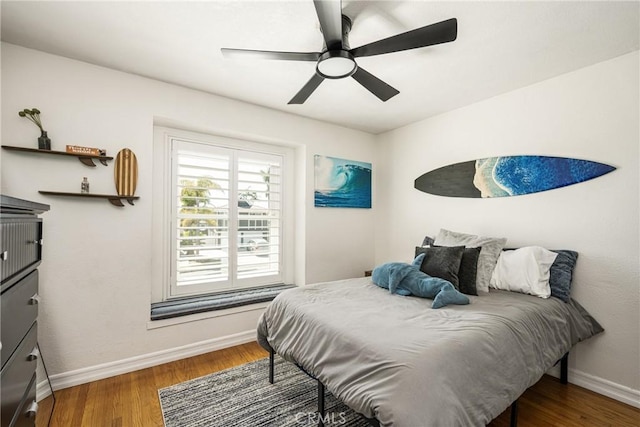 17252 Breda Ln, Huntington Beach, CA 92649 - bedroom with baseboards, wood finished floors, and ceiling fan