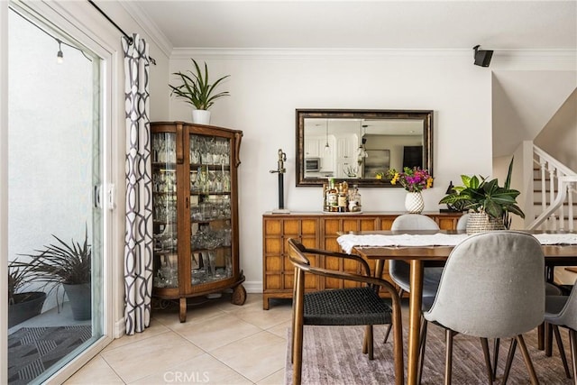 17252 Breda Ln, Huntington Beach, CA 92649 - dining area featuring ornamental molding, light tile patterned flooring, stairway, and baseboards