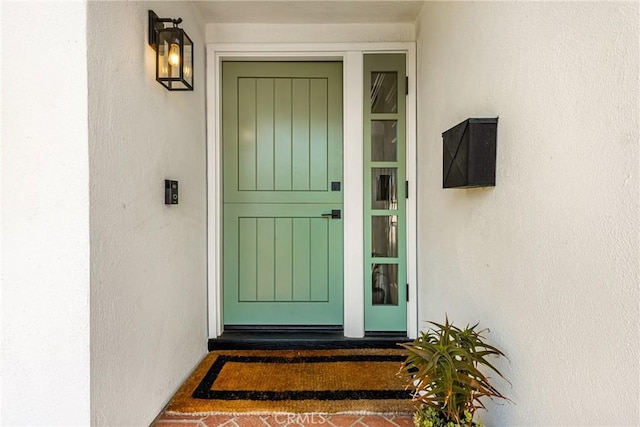 17252 Breda Ln, Huntington Beach, CA 92649 - view of exterior entry featuring stucco siding