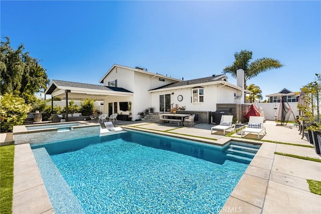 17252 Breda Ln, Huntington Beach, CA 92649 - view of swimming pool featuring a patio, a fenced backyard, area for grilling, a pool with connected hot tub, and outdoor lounge area
