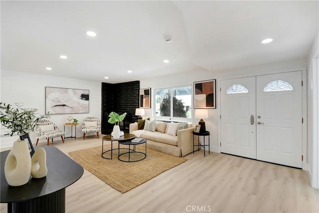 entrance foyer with light wood finished floors and recessed lighting