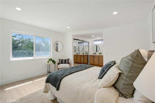 bedroom featuring recessed lighting and baseboards