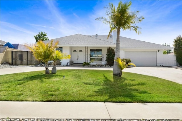 ranch-style house with concrete driveway, an attached garage, and stucco siding