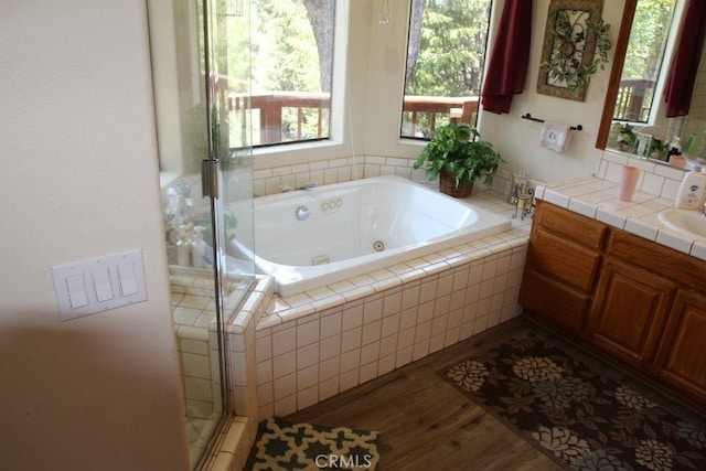 2205 Freeman Dr, Pine Mountain Club, CA 93225 - full bath featuring vanity, a whirlpool tub, wood finished floors, and a shower stall