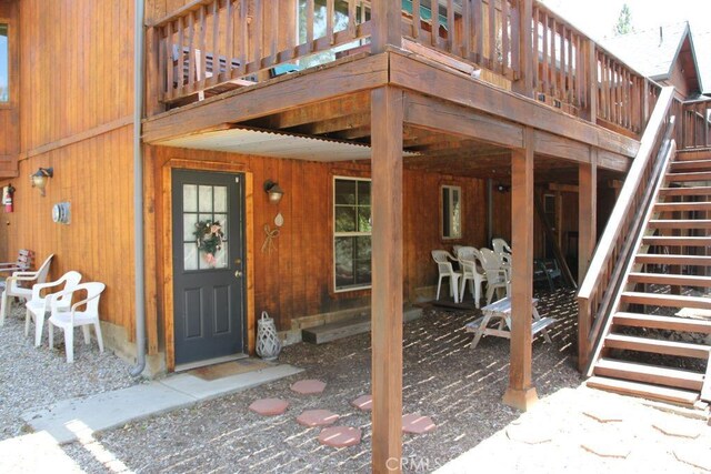 2205 Freeman Dr, Pine Mountain Club, CA 93225 - view of exterior entry with a wooden deck and outdoor dining space