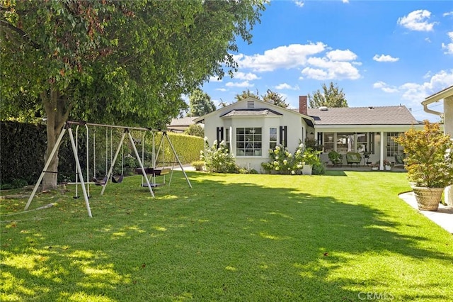 19129 E Orangepath St, Glendora, CA 91741 - rear view of property featuring a playground, a yard, a chimney, and stucco siding