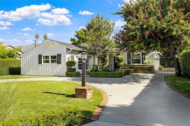 19129 E Orangepath St, Glendora, CA 91741 - view of front of home featuring board and batten siding, a gate, and concrete driveway