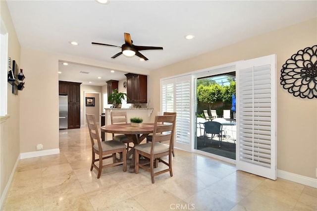 dining space featuring baseboards, a ceiling fan, and recessed lighting