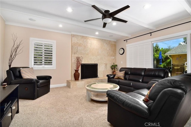 living room with beamed ceiling, ceiling fan, carpet flooring, a premium fireplace, and recessed lighting