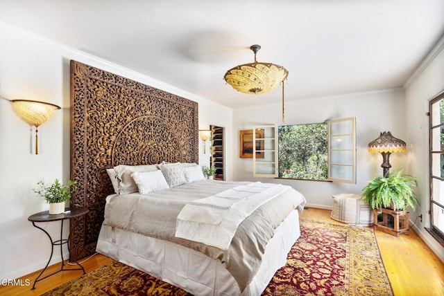 2707 Hermosita Dr, Glendale, CA 91208 - bedroom featuring wood finished floors, ornamental molding, and baseboards