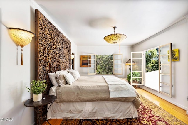 2707 Hermosita Dr, Glendale, CA 91208 - bedroom featuring wood finished floors, crown molding, access to outside, and baseboards