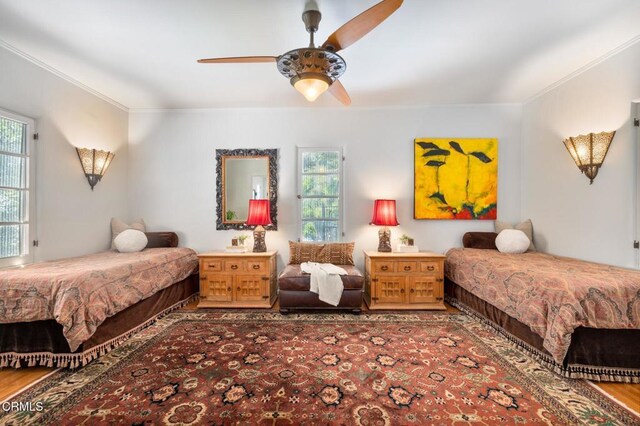 2707 Hermosita Dr, Glendale, CA 91208 - bedroom featuring ornamental molding, multiple windows, wood finished floors, and a ceiling fan