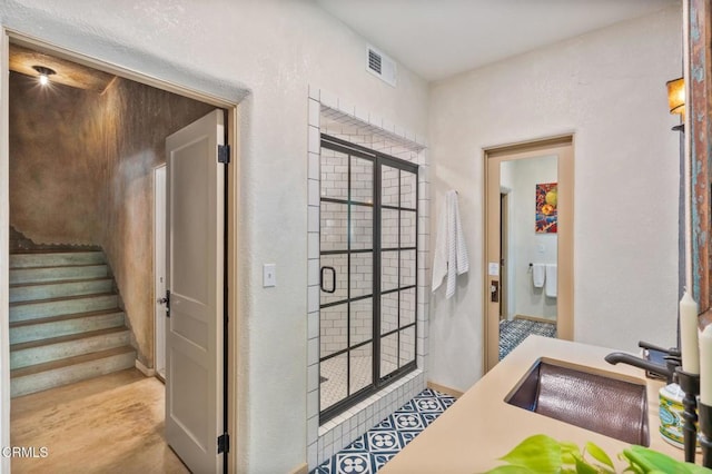 2707 Hermosita Dr, Glendale, CA 91208 - bathroom with a sink, a shower stall, and a textured wall
