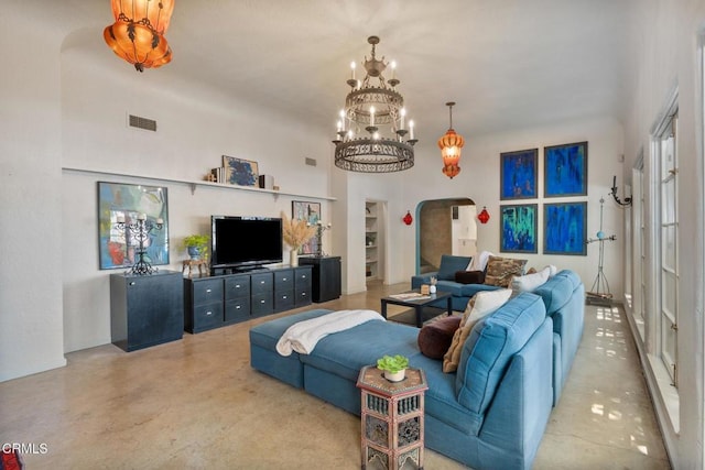 2707 Hermosita Dr, Glendale, CA 91208 - living area with arched walkways, a chandelier, and built in shelves