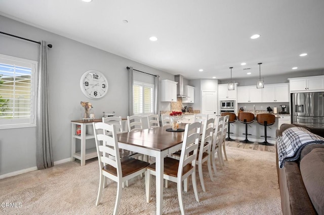 dining room with recessed lighting and baseboards