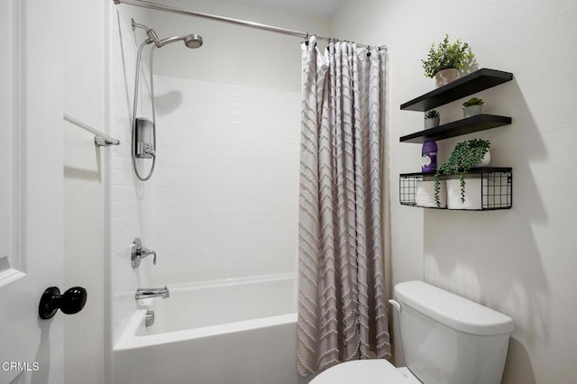 full bath featuring shower / bath combo and toilet