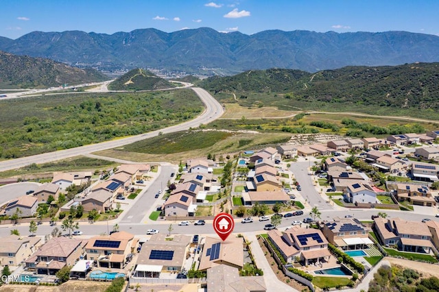 aerial view of residential area featuring a mountainous background