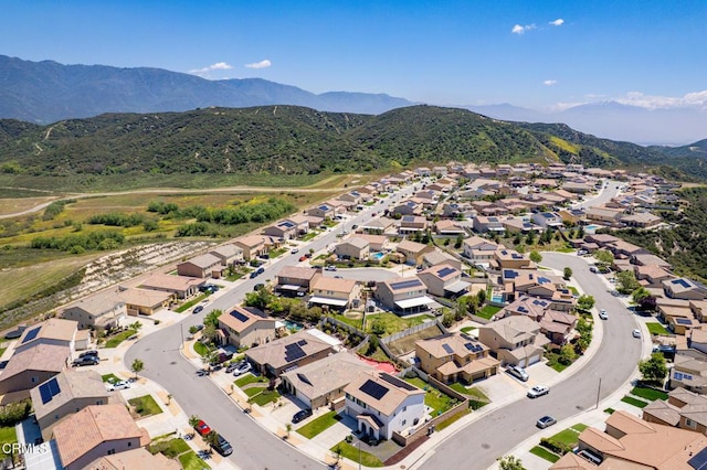 aerial view of residential area featuring mountains