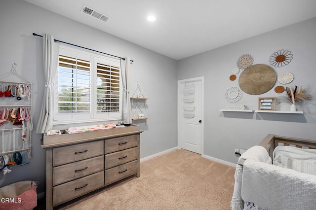 bedroom with light colored carpet, baseboards, and recessed lighting