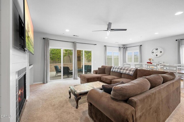 17837 Grapevine Ln, San Bernardino, CA 92407 - carpeted living area with recessed lighting, a ceiling fan, and a warm lit fireplace
