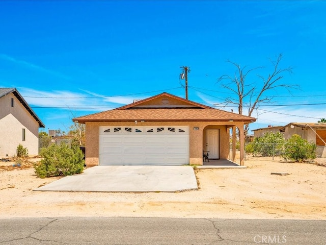 72454 El Paseo Dr Unit 29, Palms, CA 92277 - ranch-style home featuring stucco siding, fence, concrete driveway, and a garage