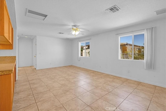 72454 El Paseo Dr Unit 29, Palms, CA 92277 - unfurnished room with ceiling fan, a textured ceiling, and light tile patterned flooring