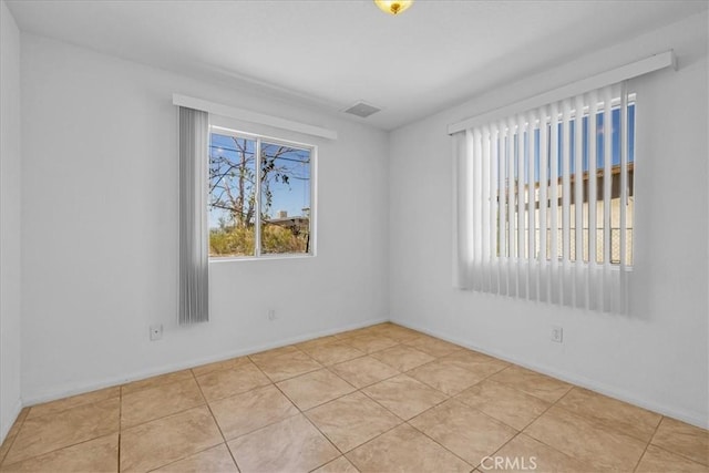 72454 El Paseo Dr Unit 29, Palms, CA 92277 - spare room featuring tile patterned flooring and baseboards