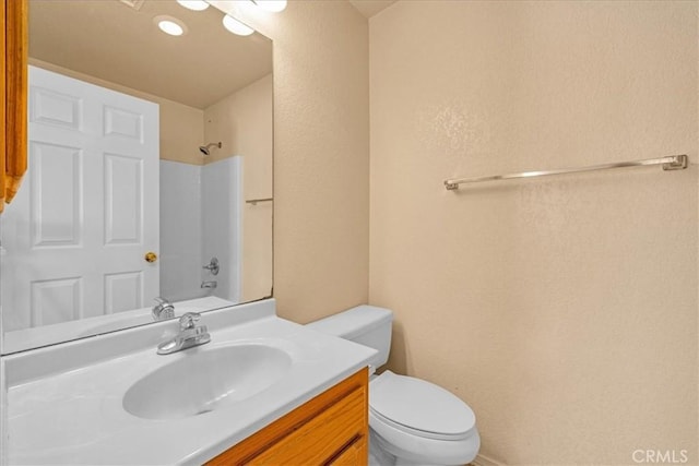 72454 El Paseo Dr Unit 29, Palms, CA 92277 - full bath with vanity, a textured wall, and tub / shower combination