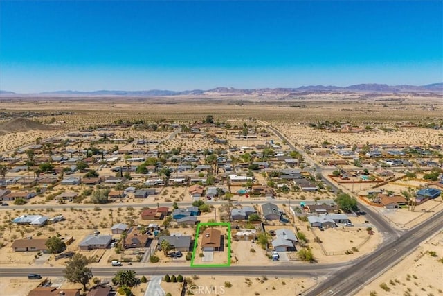 72454 El Paseo Dr Unit 29, Palms, CA 92277 - aerial view of property's location featuring a mountain backdrop and property parcel outlined