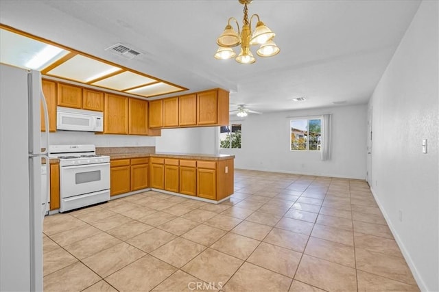 72454 El Paseo Dr Unit 29, Palms, CA 92277 - kitchen with white appliances, a chandelier, open floor plan, light tile patterned flooring, and brown cabinets