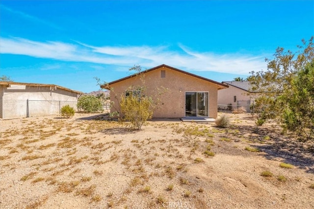 72454 El Paseo Dr Unit 29, Palms, CA 92277 - rear view of property featuring stucco siding