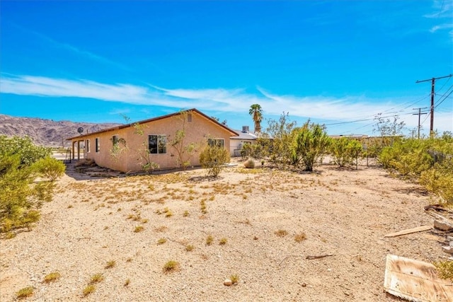 72454 El Paseo Dr Unit 29, Palms, CA 92277 - view of side of home with stucco siding
