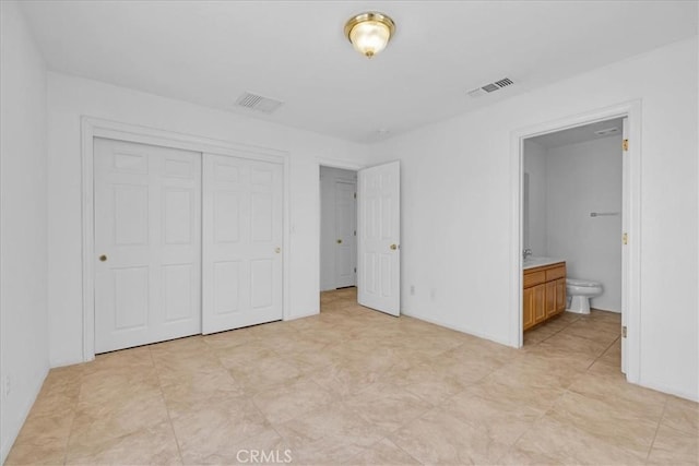 72454 El Paseo Dr Unit 29, Palms, CA 92277 - unfurnished bedroom featuring a closet and ensuite bathroom
