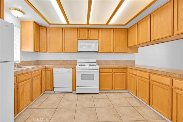 72454 El Paseo Dr Unit 29, Palms, CA 92277 - kitchen with white appliances and light tile patterned floors