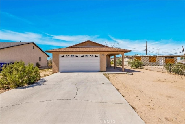 72454 El Paseo Dr Unit 29, Palms, CA 92277 - single story home featuring driveway, stucco siding, and a garage