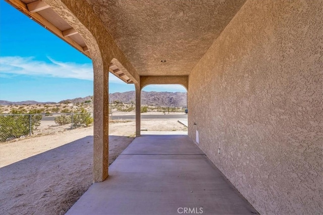72454 El Paseo Dr Unit 29, Palms, CA 92277 - view of patio / terrace with a mountain view